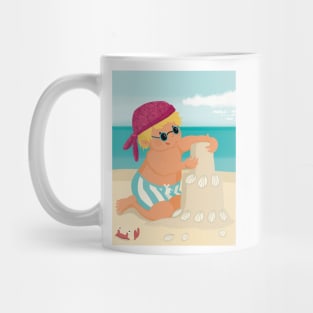 Cute little boy is on vacation building a sand castle on the beach Mug